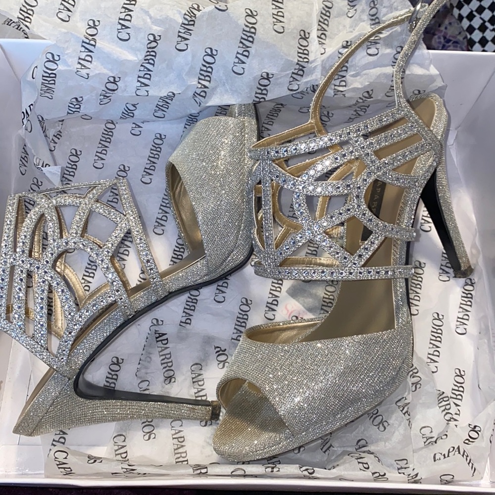 Caparros silver glimmer poet heels